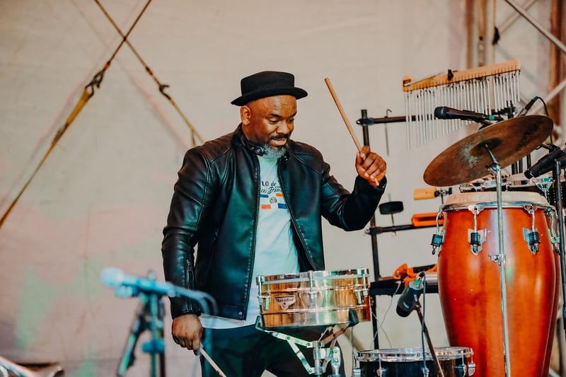 Drummer using rhythmic healing through music